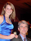 Alison Coyle at the USDF National Symposium shortly after receiving her Bronze medal, with her dad David Coyle